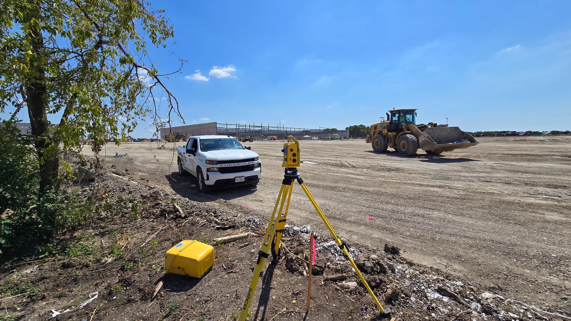surveyor transit and construction vehicles T H-E-B in Melissa, Texas